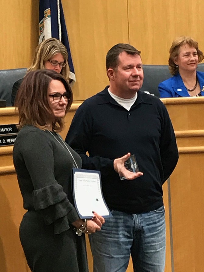 Lisa C. Merkel, Mayor of Herndon, presents the Good Neighbor Award to Roy Cooper.