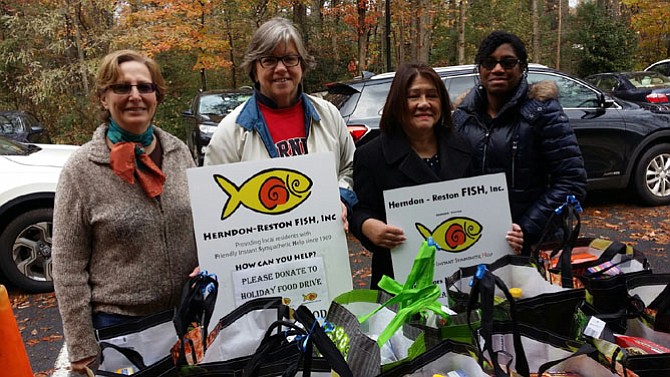 Herndon-Reston FISH volunteers gathering holiday meal kits, ready for distribution.