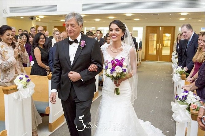 Geneva being escorted by her father at the Christian wedding ceremony. 