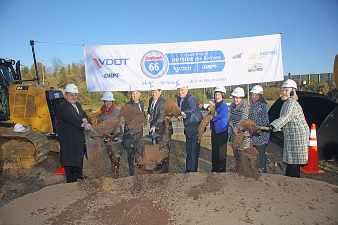 Led by Governor Terry McAuliffe (D), center, delegates, county officials and transportation officials break ground on the I-66 express lanes project.