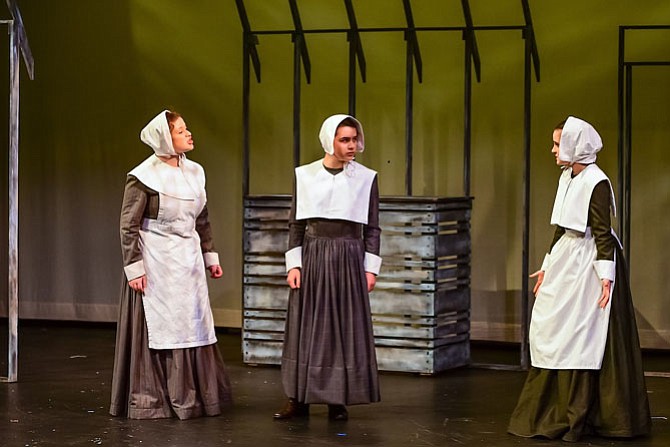 From left: Maya Jaffe, Julianne Cuevo, Hannah Khan in Flint Hill School’s production of “The Crucible.”
