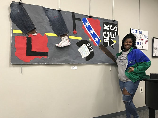 Jordan Roberts, a South Lakes High School 12th grader from Reston, pictured with her Artspeaks piece.