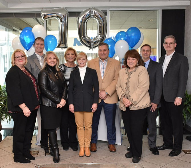 Members of Northwest Federal Credit Union’s Board of Directors and Executive Team (from left): Erin Krause, Joe Hasto, Victoria Gillespie, Mary Corrado, Jeanne Tisinger, Jeff Bentley, Phyllis Ziakas, Chuck Molina and Mike Kapfer, gather together at the credit union’s 70th Anniversary Celebration held Monday, Nov. 20, in Herndon.
