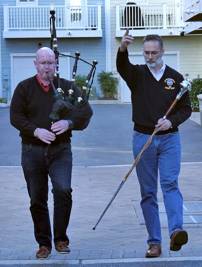 Kevin Donnelly and Konstantin Gojnycz switch roles and practice in the courtyard in back of Gojnycz's home on N. Alfred Street.