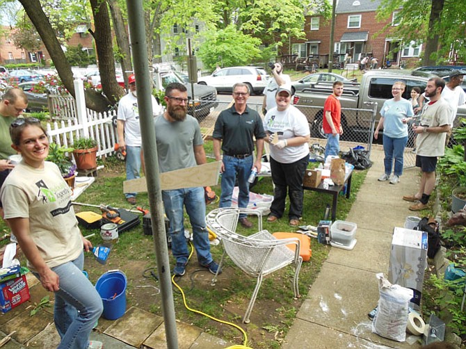Volunteers for Rebuilding Together Alexandria working on a local repair project. 