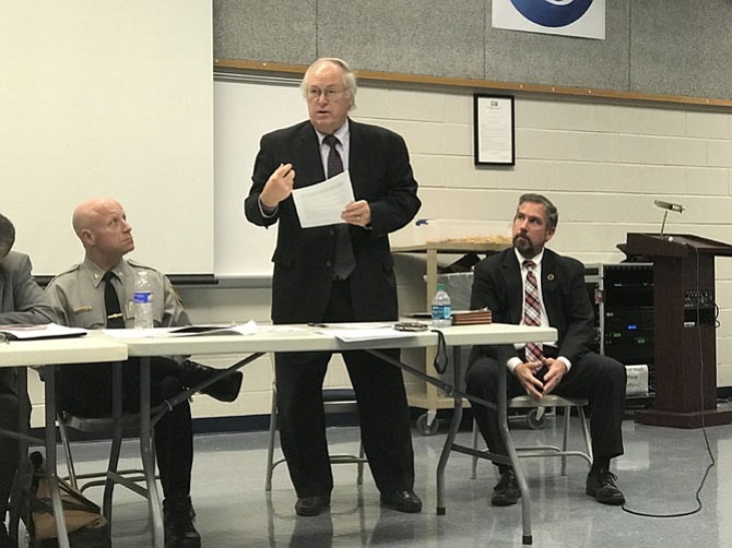 Adrian Steel of McLean explains the workings of the Civilian Review Panel while Police Chief Edwin Roessler and Independent Police Auditor Richard Schott look on at a Mount Vernon meeting in November.