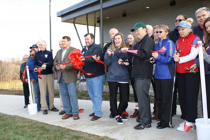 The ribbon is cut for the new clubhouse at Burke Lake Golf Course.