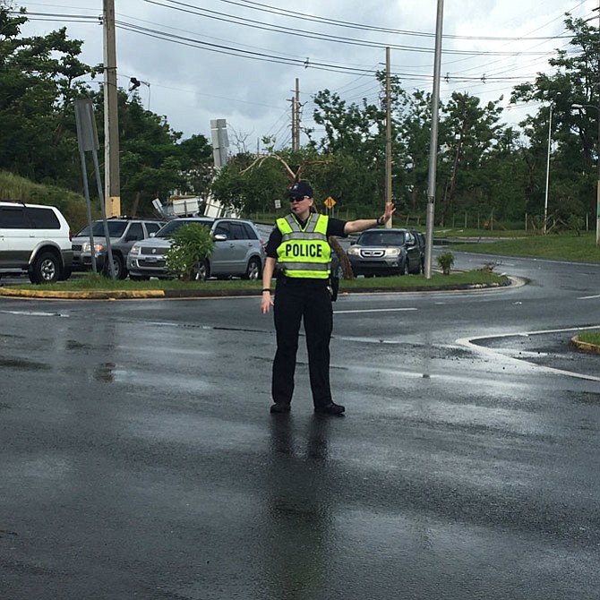 Arlington County Police Department Officer Sarah Butzer directs traffic in Puerto Rico.