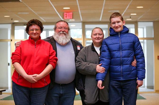 From left: Bridgette Beach; Karl Wilkerson, an officer with CHO and Reston resident; Teresa Creighton, Vienna resident and baker; and her son Sam Creighton, 13, who is homeschooled; pictured at Vienna Committee for Helping Others’ Christmas store at Vienna Presbyterian Church Saturday, Dec. 9. 