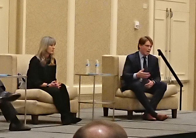Asana Partners Director of Development Reed Kracke, right, discusses the firm’s development strategy for Old Town at the Chamber of Commerce annual meeting Dec. 5 at the Hilton Mark Center. With him is Asana Partners Director of Merchandising and Leasing Kate Grissom.