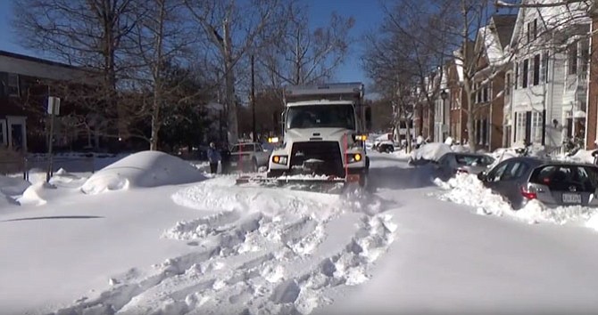 Alexandria City snow plow at work.