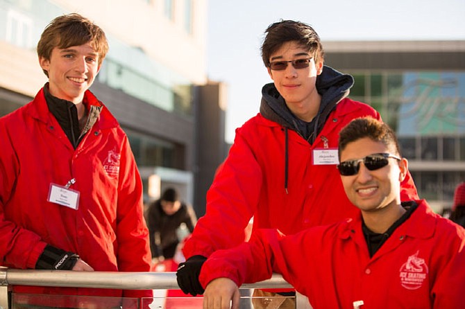 Sam Ellis, 16, junior at Marshall High School, from Vienna, a skate host, Alejandro Catacora, 16, sophomore at Albert Einstein High School, and Amir Sefat, manager on duty Saturday, George Mason University senior, pictured at the ice skating rink at Tysons Corner Center Saturday, Dec. 16. 