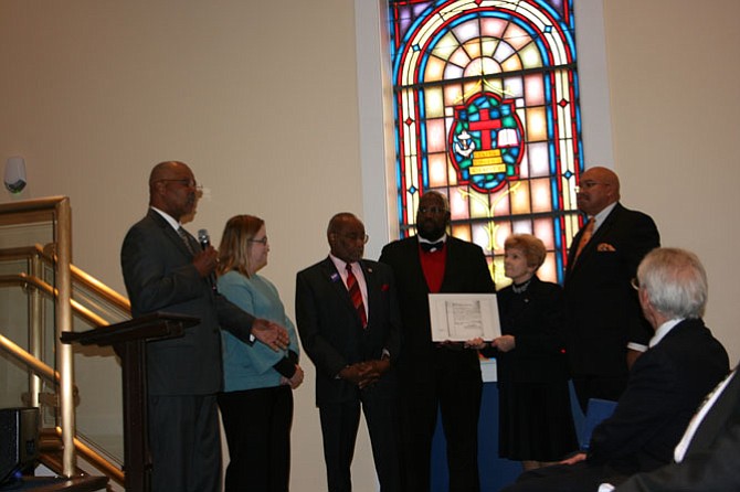 From left: MacArthur Myers; Krystyn Moon, Ph.D., University of Mary Washington; former Mayor Bill Euille; Councilmembers John Chapman and Del Pepper; the Rev. James V. Jordan, Third Baptist Church; and Dr. F.J. Pepper recognize the election of George Washington Parker, the first African-American councilman to serve Alexandria.