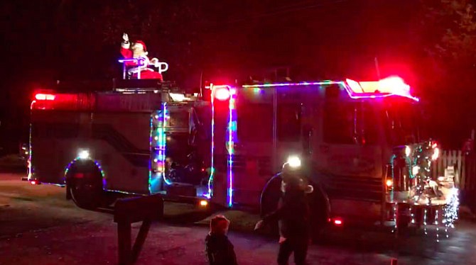The Cabin John Park Volunteer Fire Department Santa rides the fire truck into neighborhoods, delighting families and collecting toys for children living in homeless shelter.