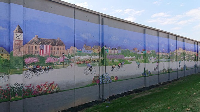 The Mural at Greenhill Properties, located on the Edsall Road side of the building at 611 S. Pickett St., was officially unveiled Nov. 30 by city officials and local artists Cindy Wallace and Len Garon. Called “Time Travel,” the mural is two stories high and 300 feet long and depicts the local history of the area.