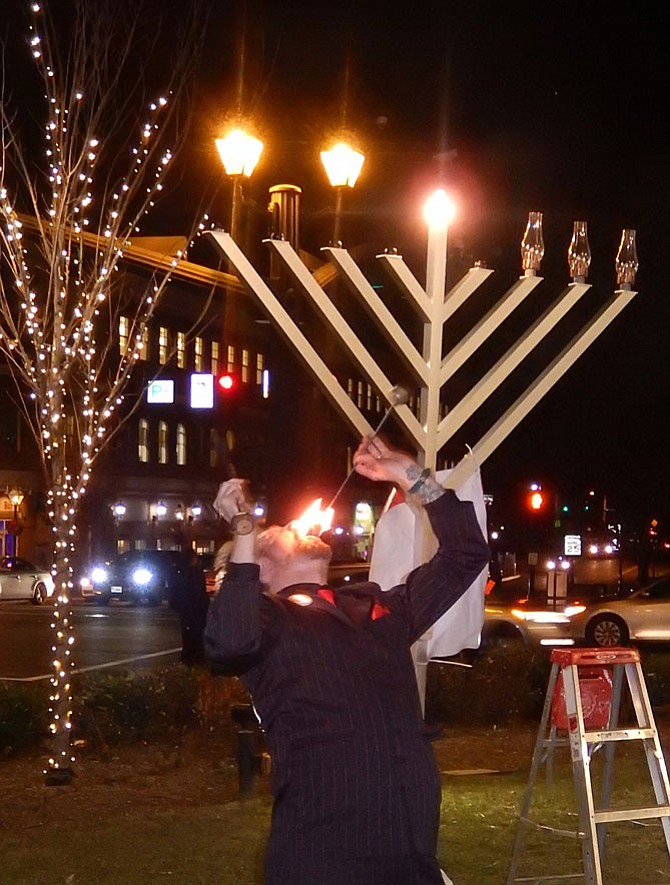 Fire-eater Tyler Fyre amazed the crowd during last week’s Chanukah celebration in Old Town Square.