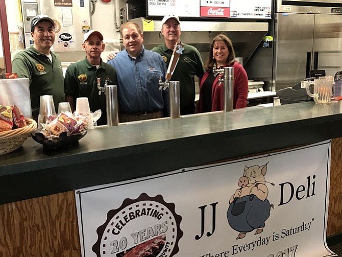 From left: Jose Carrera, Mark Duff, Horacio Carrera, Jeff Johnson, and Jackie Johnson man the counter at JJ Deli in Herndon, ready to serve up their award-winning BBQ and famous soups one last time before closing the doors on the establishment Dec. 31, 2017.