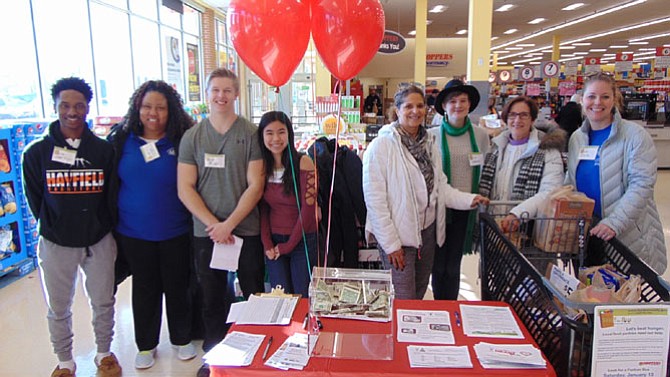 A mix of volunteers at Shoppers Food Warehouse at Mt. Vernon Plaza from Fairfax County, Neighborhood and Community Services, Office of Public, Private Partnerships, and MV Transportation.