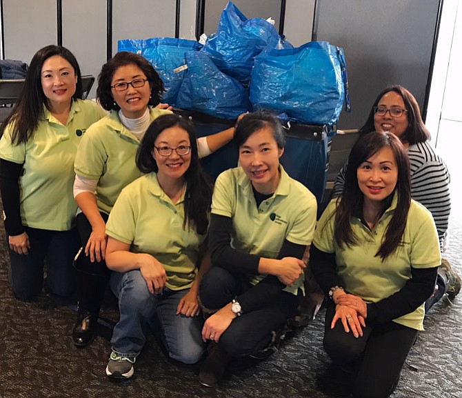 From left: Founding members of Jade Philanthropy Society Jennifer Lee, Jenet Ahn, Grace Wolf Cunningham, Nina Un, Hong Pham and Smita Dutta gather at Open Door Presbyterian Church in Herndon, after helping to pack 350 meals there for the teen shelter, Second Story, formerly Alternative House in Vienna. 
