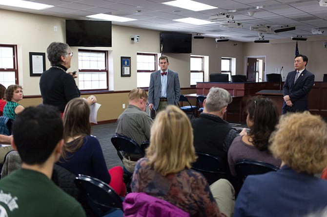 Marisa Brown asks state Sen. Chap Petersen (D-34) and Del. Mark Keam (D-35) a question about the Medicaid waiver waiting list in Virginia at a Vienna Town Hall meeting Saturday, Jan 27.