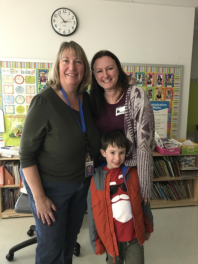 Noelle Brinley, Jackie Cotter and her son Everett at the holiday party.