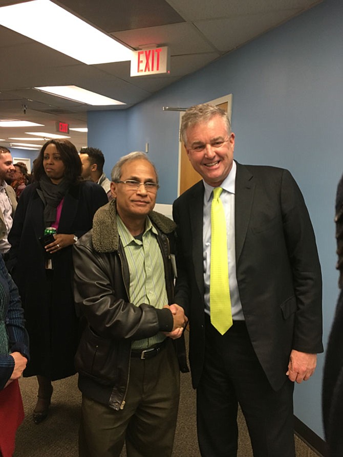 David Trone with Potomac resident Mike Tofigh during the opening of Trone’s campaign headquarters Thursday, Feb. 1. Trone is a Democrat running for Maryland’s Sixth Congressional District.