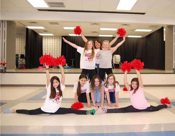 Front row (in splits, from left): Lauren Farfan (fifth grade), Sofia Baranovsky (fourth); Middle row (on knees) Alice Wigmore (fifth), Malory Kroeger (sixth), Maya Seymour (fifth); Back row (on top) Katie Merritt (fifth), Robin DeRosa Lundgren (Coach), and Meredith Lukas (fifth).