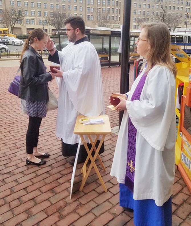 Matthew Welsch, director of Children’s Ministries, and the Rev. Heather VanDeventer, associate rector, Historic Christ Church, at Ashes to Go in 2017.