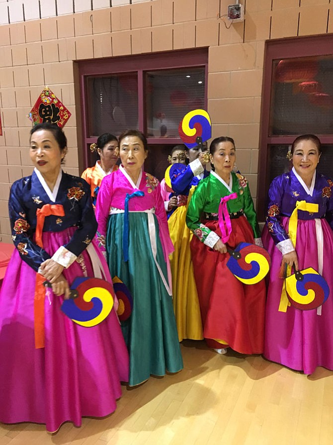 Women from the Korean Culture and Art Center of Maryland line up before performing a Korean Folk Dance at the Lunar New Year Celebration Sunday.