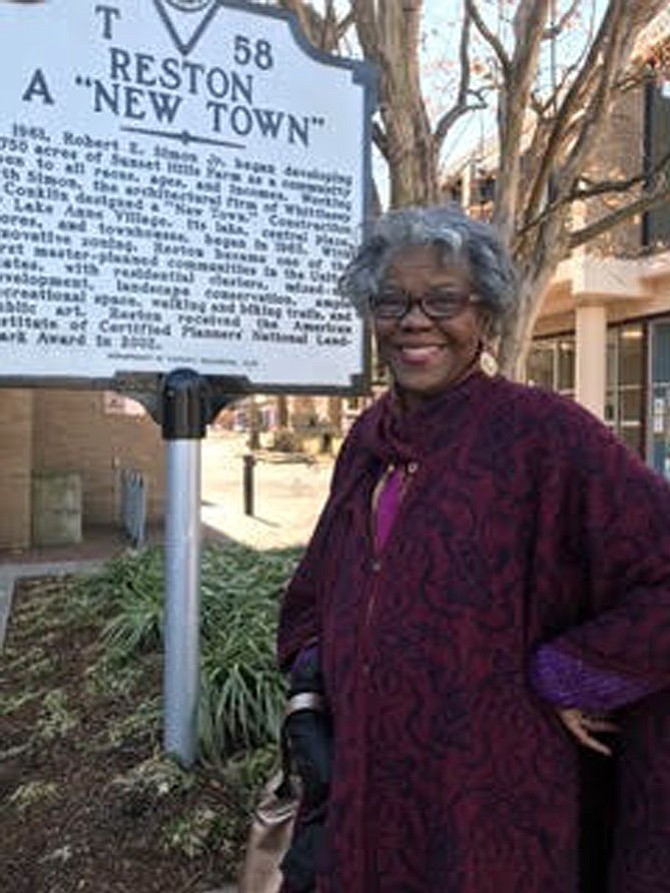 Rev. LaVerne Gill, author of five books, stands beside the waymarker located at Lake Anne in Reston noting the founding of the planned community. In her most recent book, "Reston's African American Legacy, Volume No. One" she celebrates 25 African American pioneers who made a difference in a "New Town."
