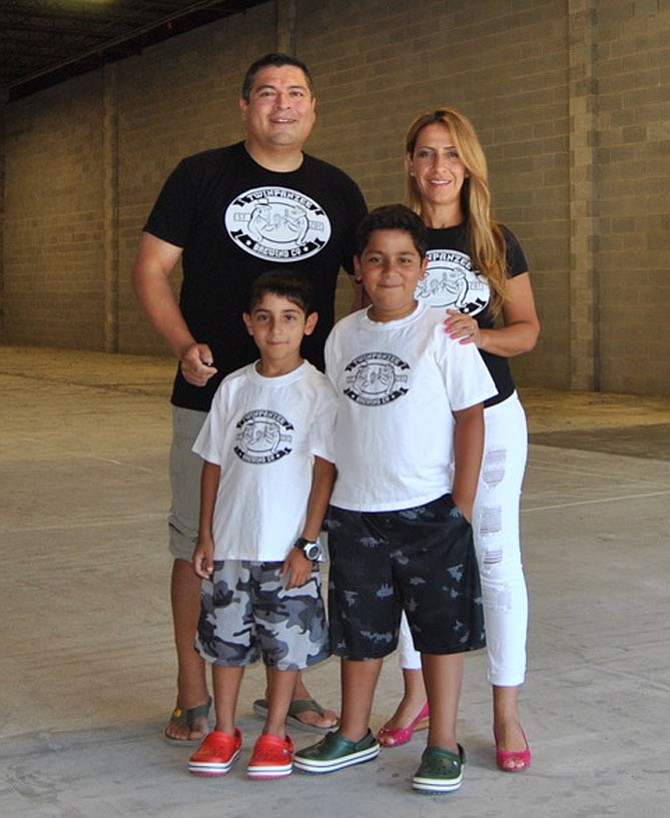 Antonio Maradiaga and his wife Maha Majdoub, with their 10-year-old twins.