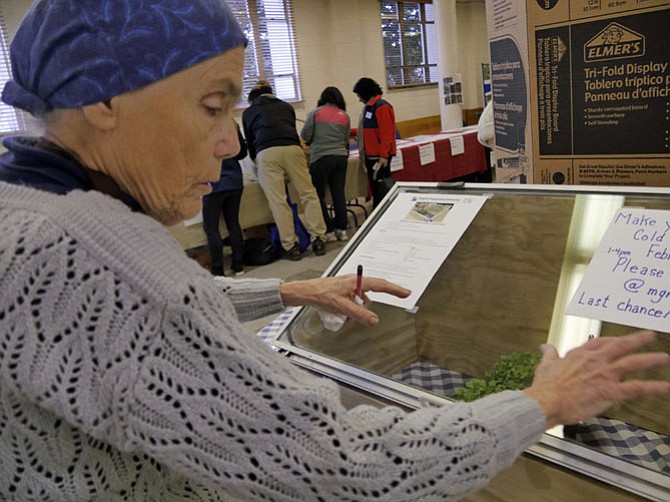 Georgia Rangel, Virginia Cooperative Extension Service Master Gardener intern, explains the advantages of cold frame gardening at the Arlington Food Assistance Center Spring Garden Kick-off on Feb. 10.