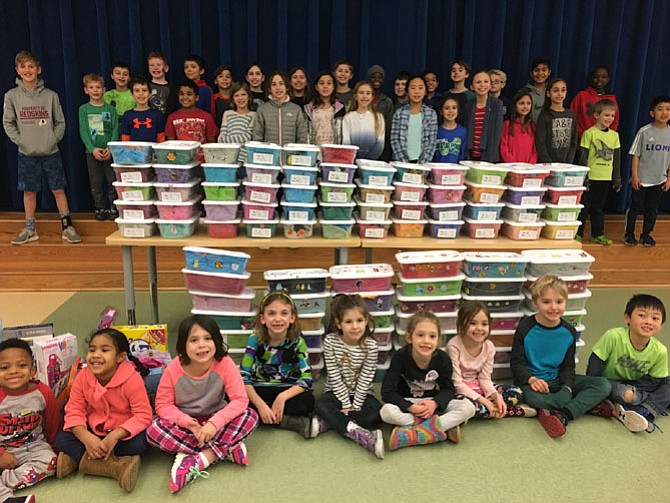 Wayside Elementary School student volunteers show the 100 gift boxes they packed for the Jared Box Project. The boxes will be given to hospitalized children.