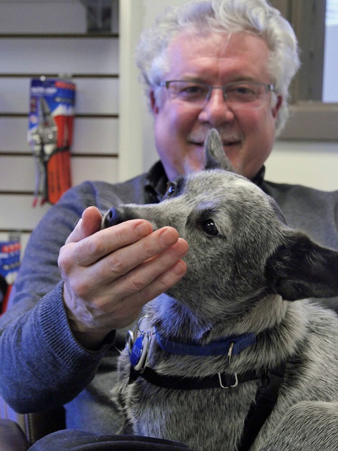 David Heiby, president and CEO of Auto-Grip with office dog, Blue.