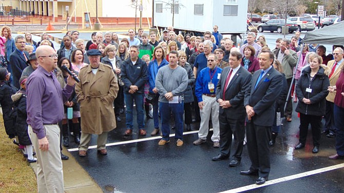 Darren Brown, executive pastor, leads in the singing at the ground-breaking ceremony of Burke Community Church’s $17.2 million campus expansion.