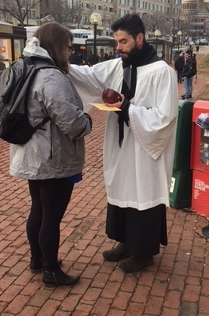 About 200 people received Ashes to Go from Santiago Rodriguez, Youth Minister at Historic Christ Church, and the Christ Church team at the King Street Metro on Feb. 14, Ash Wednesday. This was part of a national effort begun several years ago in St. Louis to offer ashes on the streets on the first day of Lent.