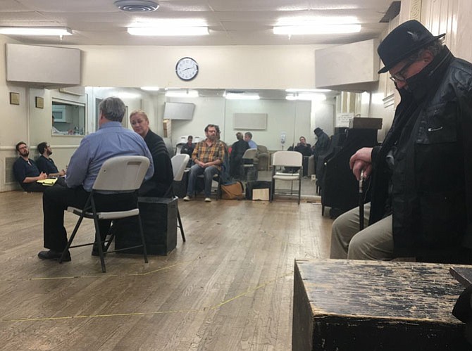 From left: Ruben Vellekoop (director) listens in the background as Brian Lyons-Burke (Prime Minister John Major); Nicky McDonnell (Queen Elizabeth II); Paul Donahue (the Equerry); and Robert Heinly (as Winston Churchill) rehearse for LTA’s production of “The Audience.” 