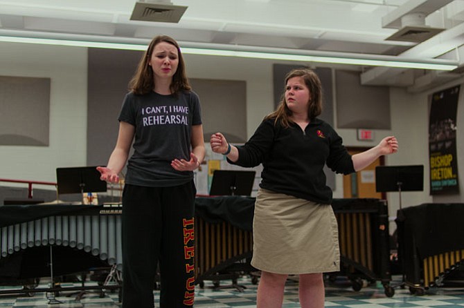 Bishop Ireton High School students (from left) Dagny Scannell as Wednesday and Libby York as Pugsley rehearsing "Pulled" for “The Addams Family Musical.”