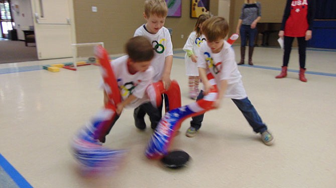 Four-year-olds in Mrs. McPeek’s and Mrs. Metcalf’s class compete in hockey.