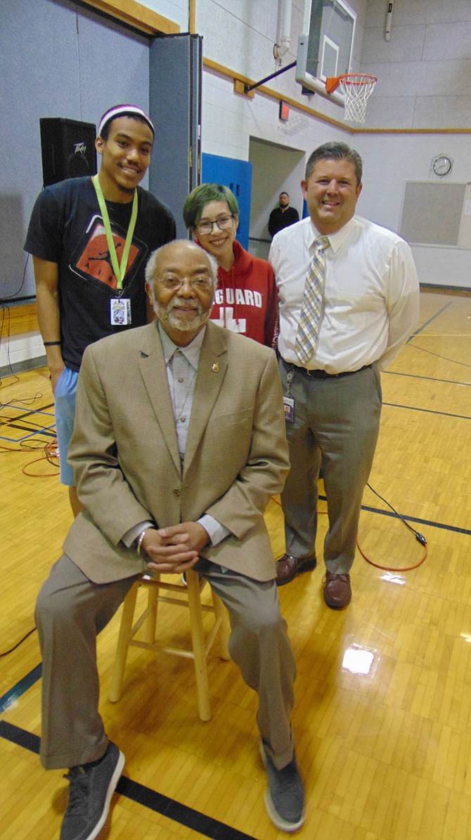 Rohulamin Quander, Esq., with Donnell Hudson, Noah Phuong, and Principal Joe Thompson.