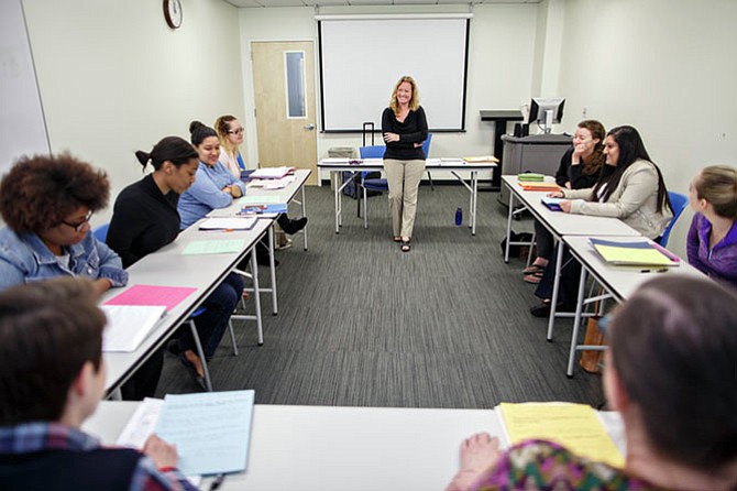 Mental health counseling professor Lisa Jackson-Cherry, Ph.D. leads a class discussion with future therapists about discussing high-profile tragedies with children.