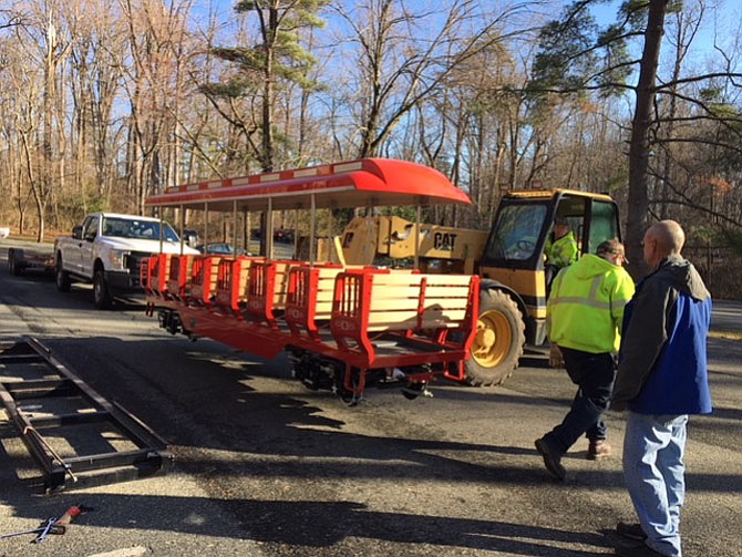 A new train car is loaded onto the track.