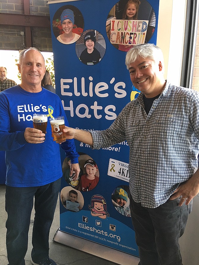 Jay Coakley and Sean Hunt toast to Ellie’s Hats’ fourth anniversary.