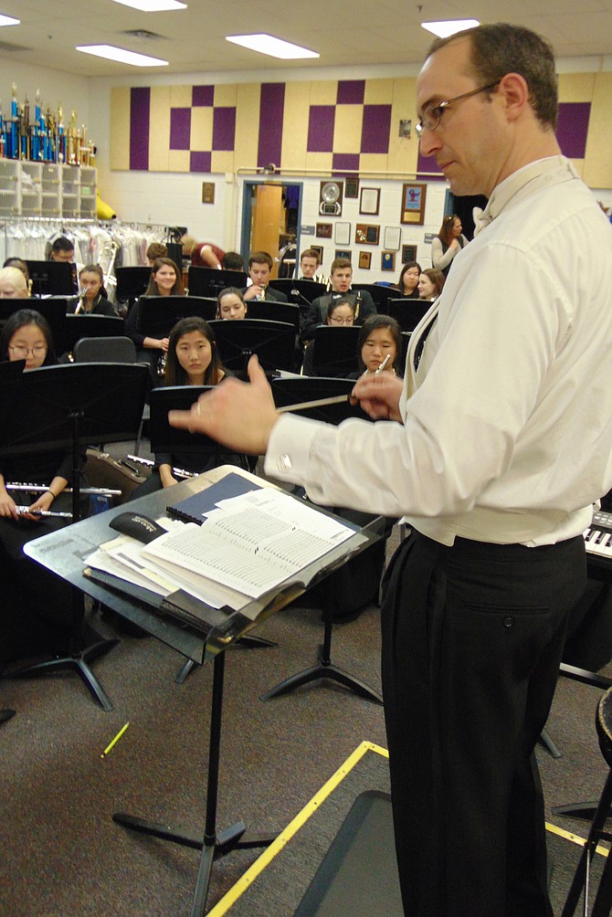 Mike Luley, Lake Braddock Director of Bands, conducts students in the Symphonic Band. The school won the national award, the Sudler Flag of Honor by the John Philip Sousa Foundation.