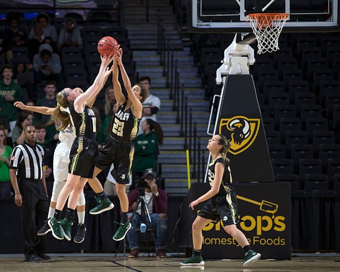 Lauren Maloney #11 and Rana Azad #23 seem to have the upper hand over Nia Covington #13.