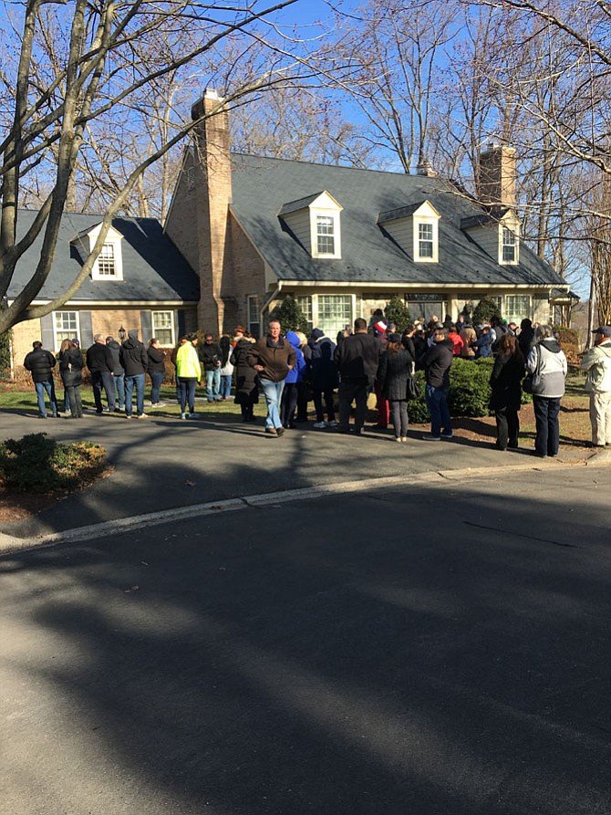 Shoppers and sightseers line up before the opening of the estate sale at the former home of former astronaut and U.S. Sen. John Glenn in Potomac Sunday, March 11.