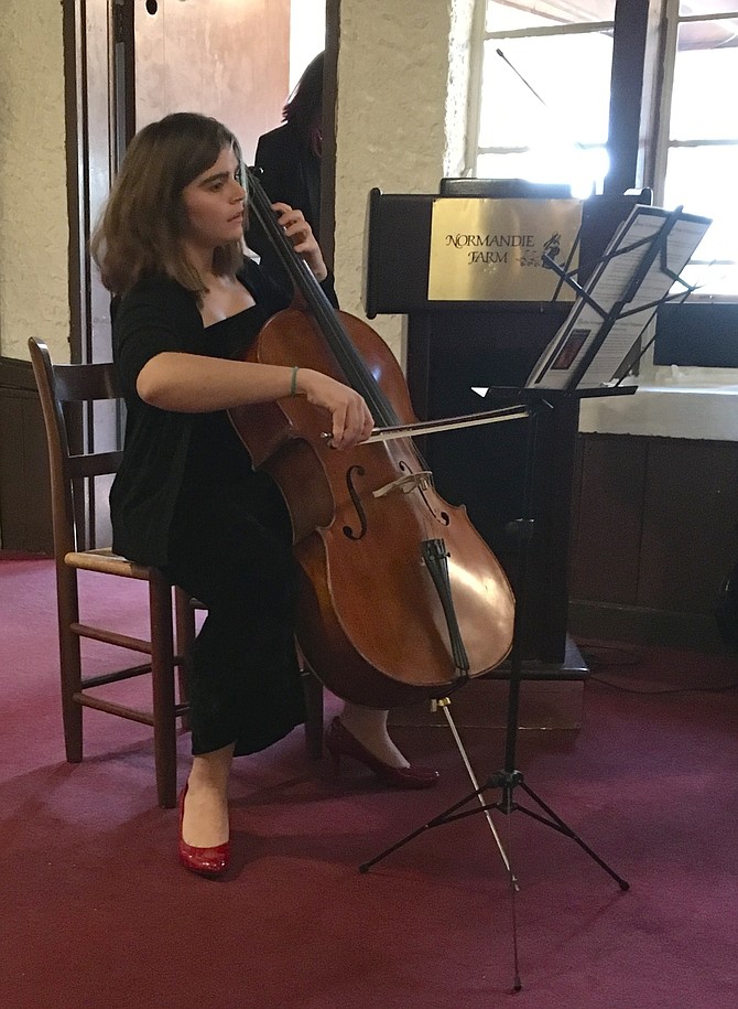 Granddaughter Isabel Srour performs a meditation at memorial service for Farid Srour on Sunday, March 11 at Normandie Farm Restaurant.