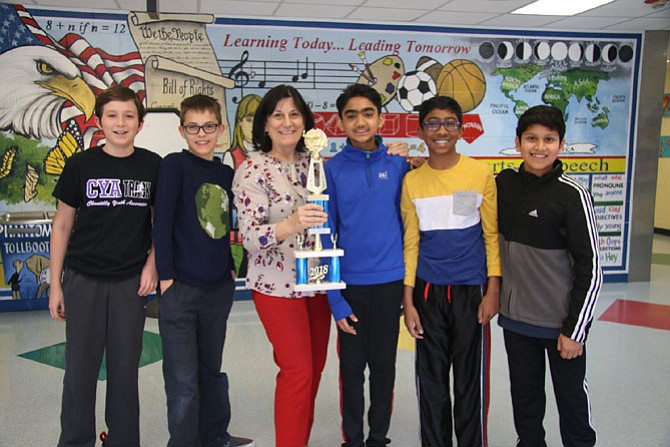 Floris Elementary School finished fourth in the Regional Competition for the 2018 National Science Bowl. Alec Riso, Theo Kiewel, Arnav Mathur, Pranav Panicker, and Mihir Kulshreshtha present the award trophy to Gail Porter, Principal of Floris Elementary School.