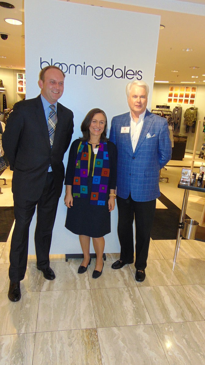 Paul Kohlenberger, President of the Greater McLean Chamber of Commerce and model; Desi Woltman, Event Chair; and Bill DuBose, emcee.