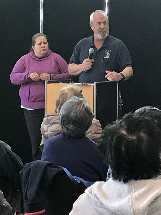 Melissa Smarr, Chief Code Development and Compliance at Fairfax County Government, and Scott Hagerty, Code Enforcement Investigator at Fairfax County Government, provide fraud-fighting suggestions to seniors during the Silver Shield Anti-Scam Presentation held Wednesday, March 7 at the Herndon Senior Center, 873 Grace Street.